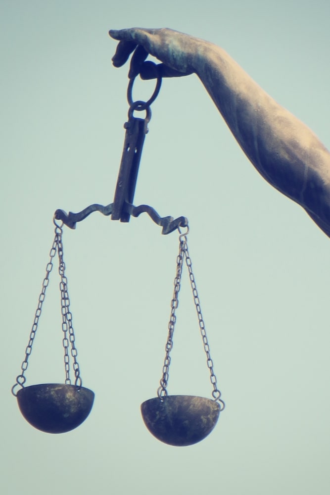 law scale being held up